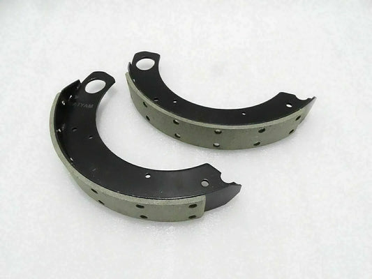 Brake shoe set with lining for Massey Ferguson model, durable steel construction for reliable braking performance