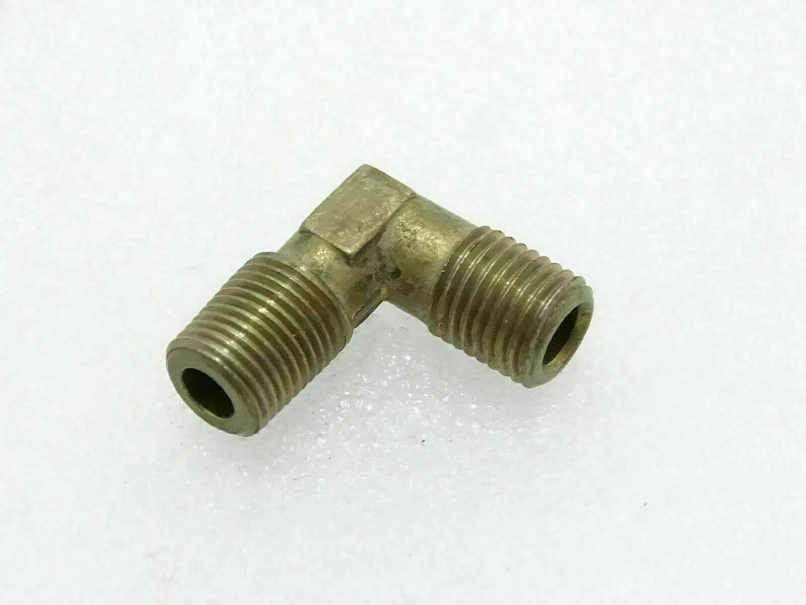 Brass connector for Massey Ferguson model, 90-degree angle, durable material for efficient plumbing