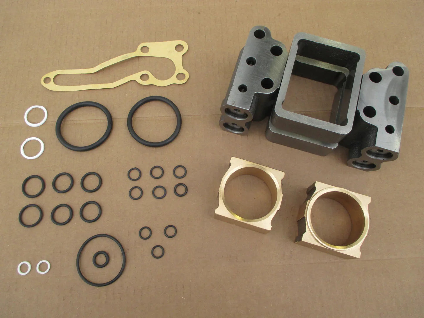 Hydraulic pump repair kit with metal sleeves, gaskets, O-rings, and seal rings