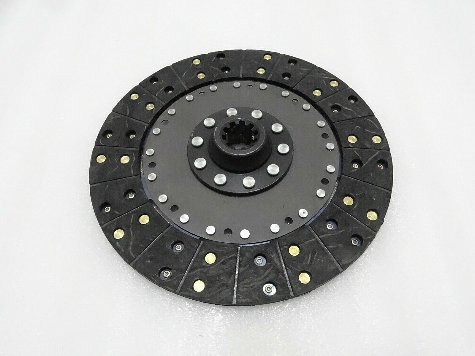 Massey Ferguson black clutch plate with 10-spline center and riveted pressure segments