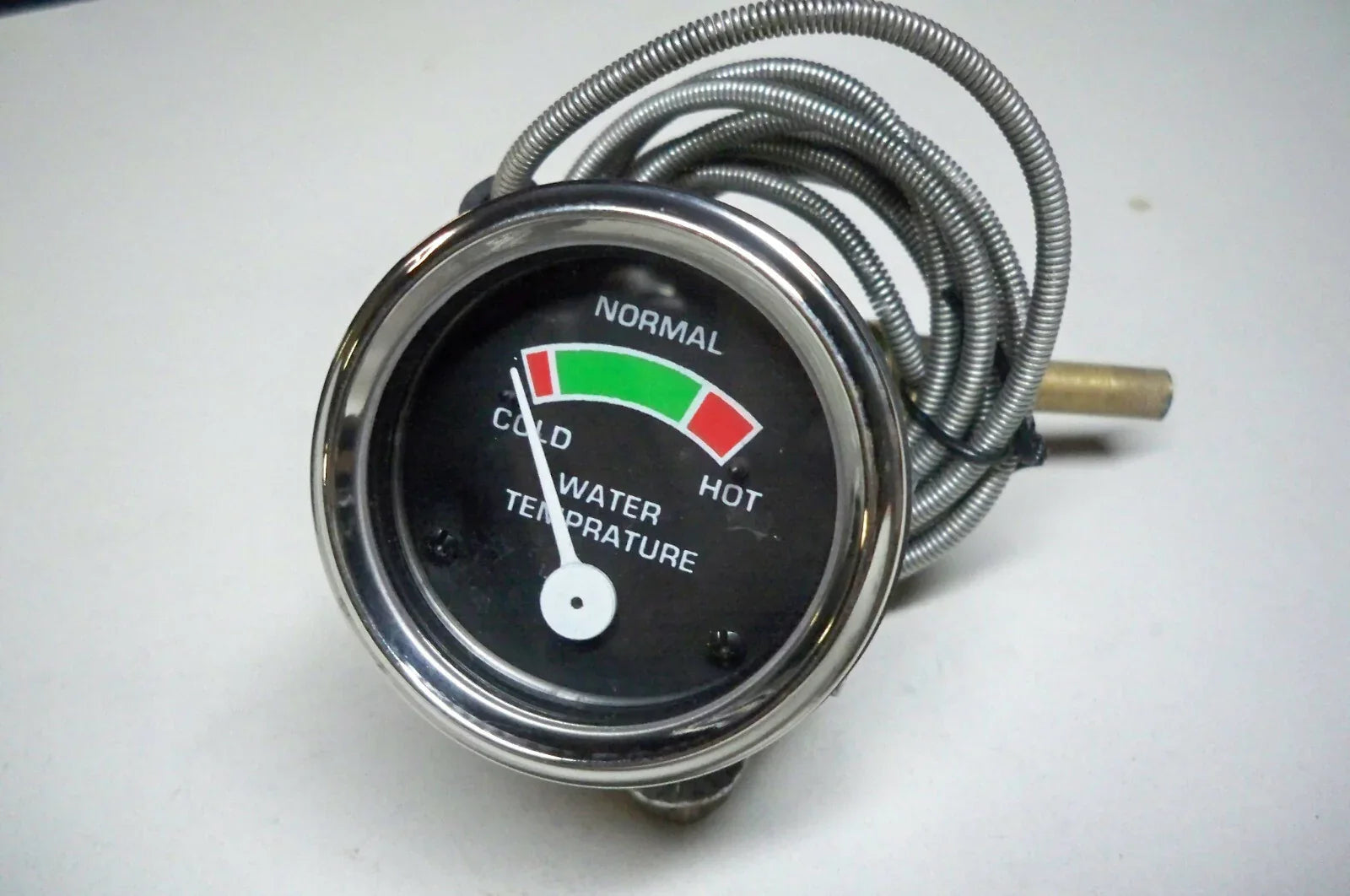 Massey Ferguson model temperature gauge with metal casing and temperature indicator for tractors