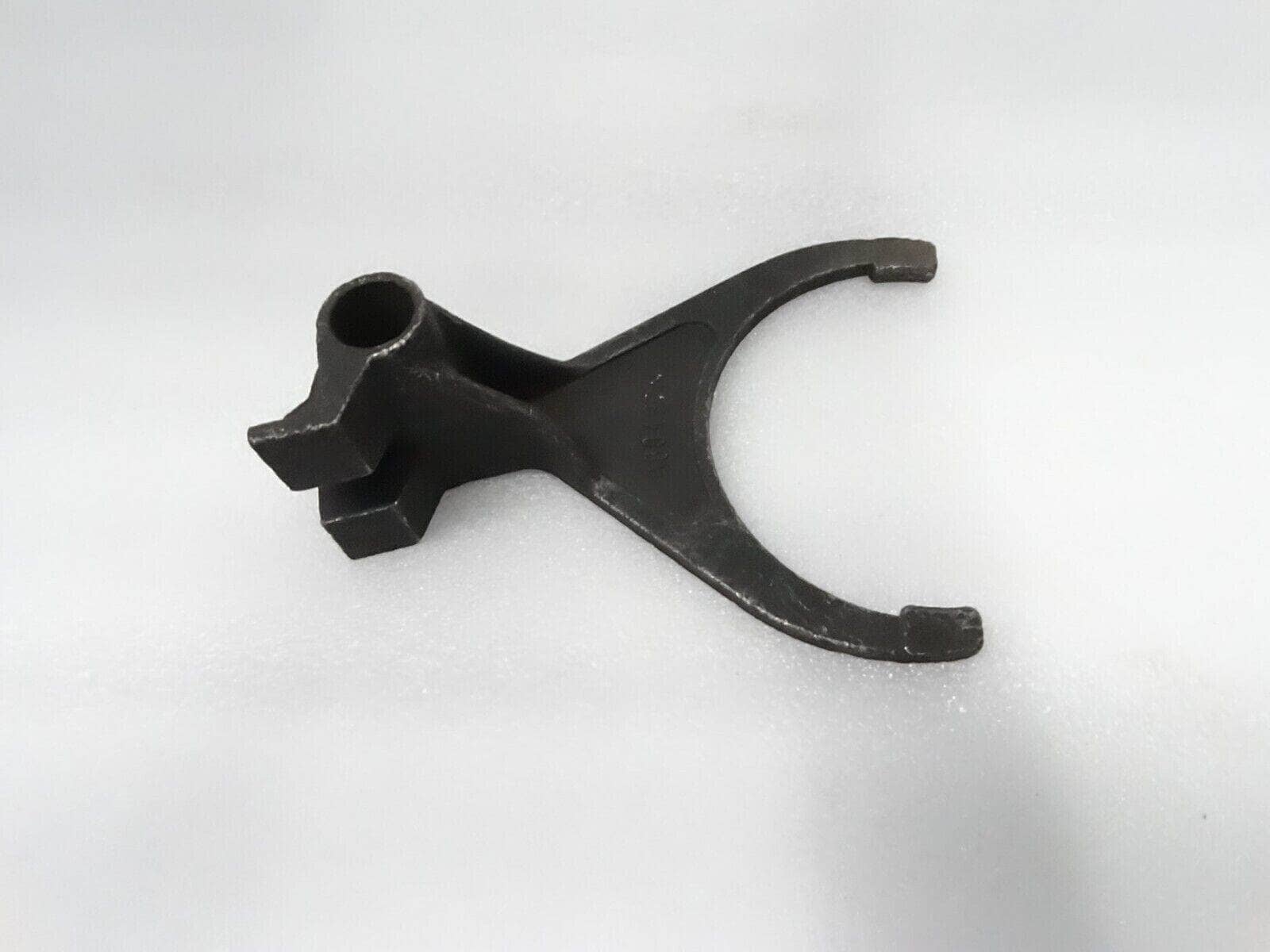 Massey Ferguson shift fork made of durable metal for reliable tractor transmission function