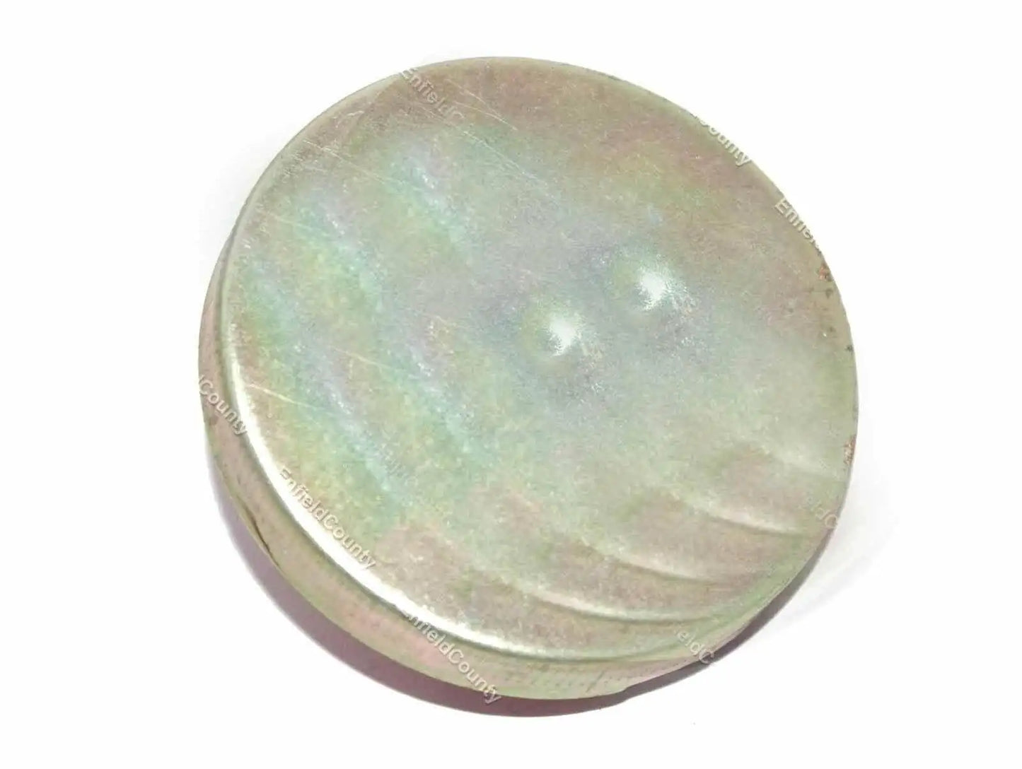 Fuel tank cap, round metal cover with worn greenish finish