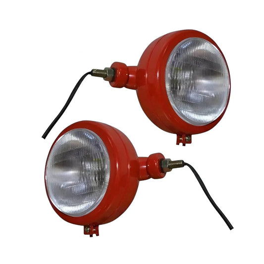 Pair of round tractor headlights with red housing, clear glass lenses, and black wiring