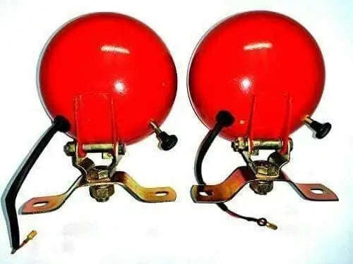 Red plough lamp pair with round bulbs, metal brackets, and wiring leads
