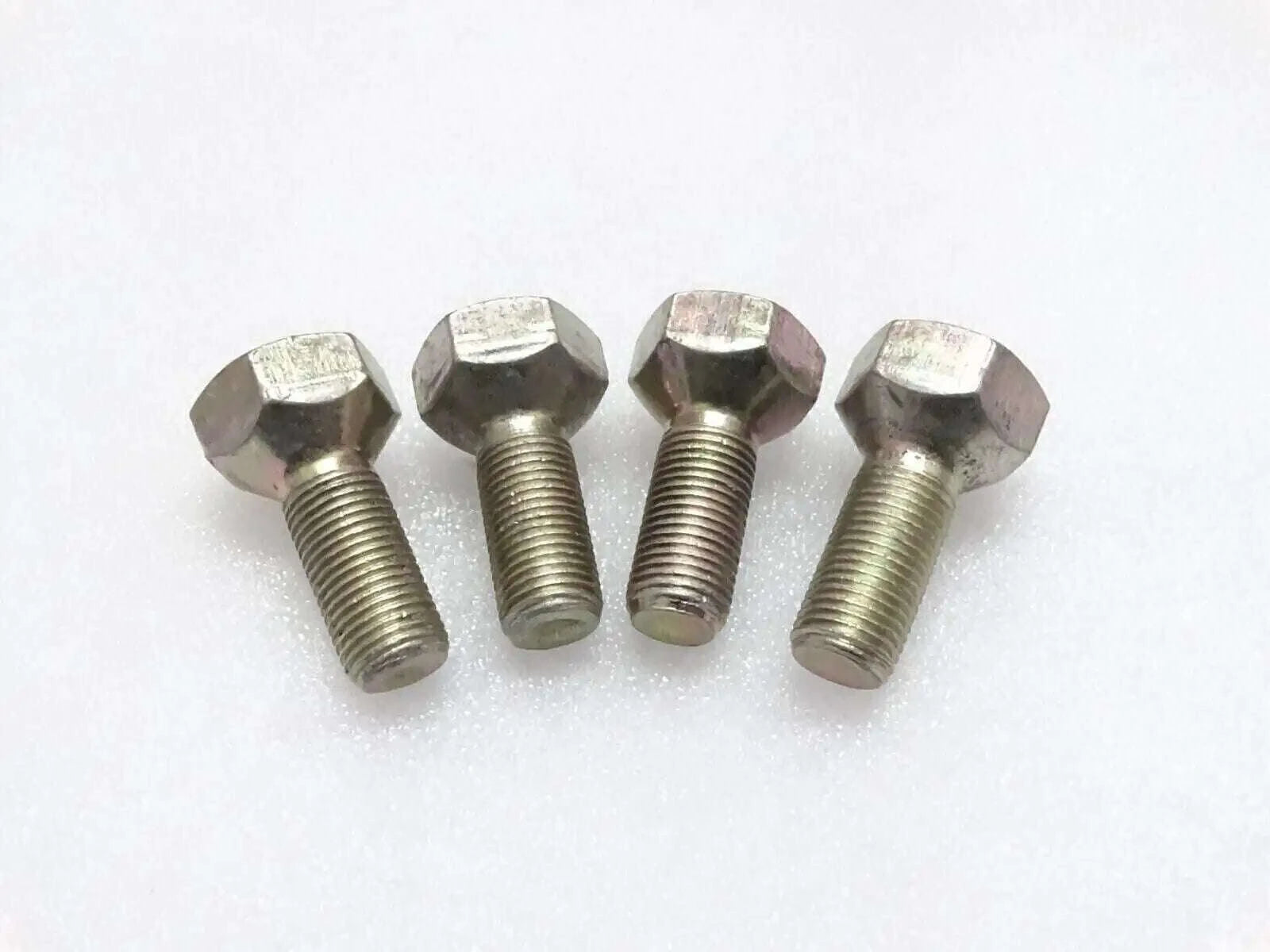 Four front wheel bolts with hex heads and threaded shanks, silver steel