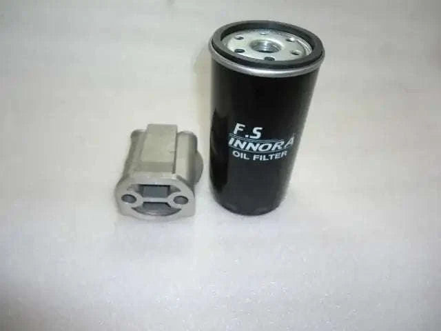 Oil filter head assembly with black oil filter canister and metal mounting bracket
