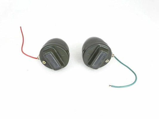 Pair of black cat-eye marker lights with wiring harness, round with clear lens