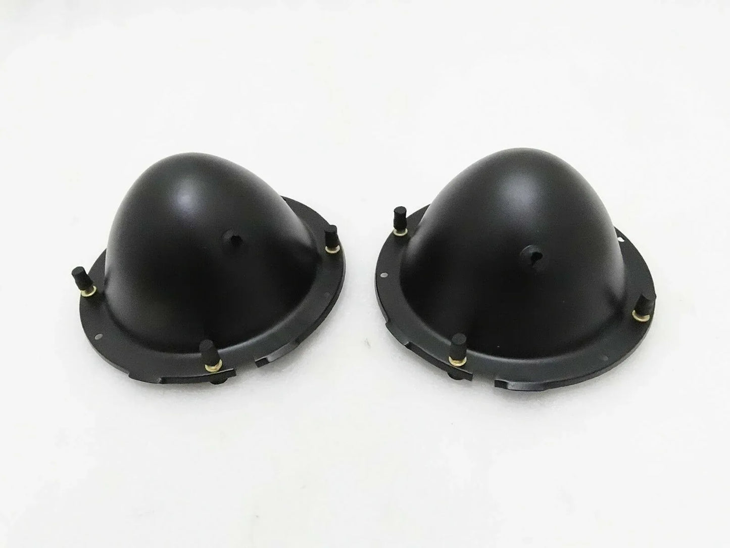 Pair of black headlight holding buckets with mounting tabs and screws