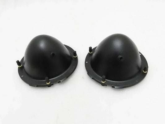 Pair of black headlight holding buckets with mounting tabs and screws