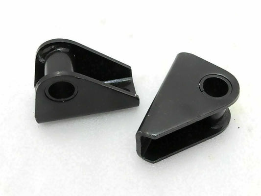 Suspension shackle bracket kit with two black metal brackets and mounting holes
