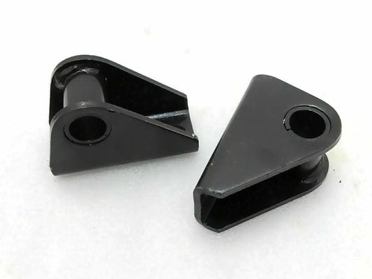 Suspension shackle bracket kit with two black metal brackets and mounting holes