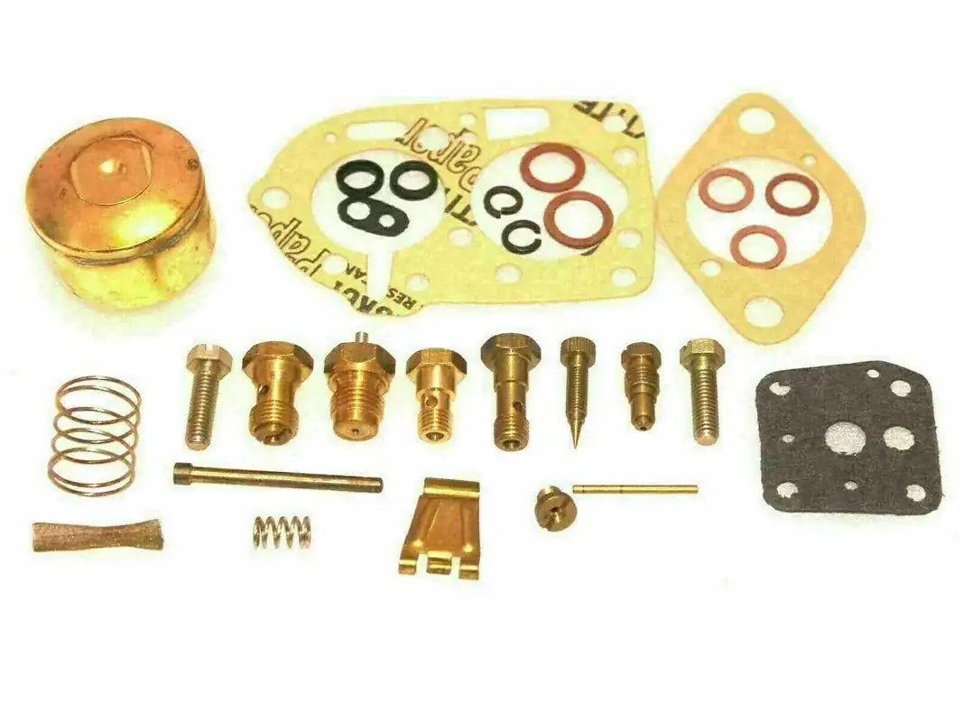 Carburetor repair kit with gaskets, screws, springs, and small hardware pieces
