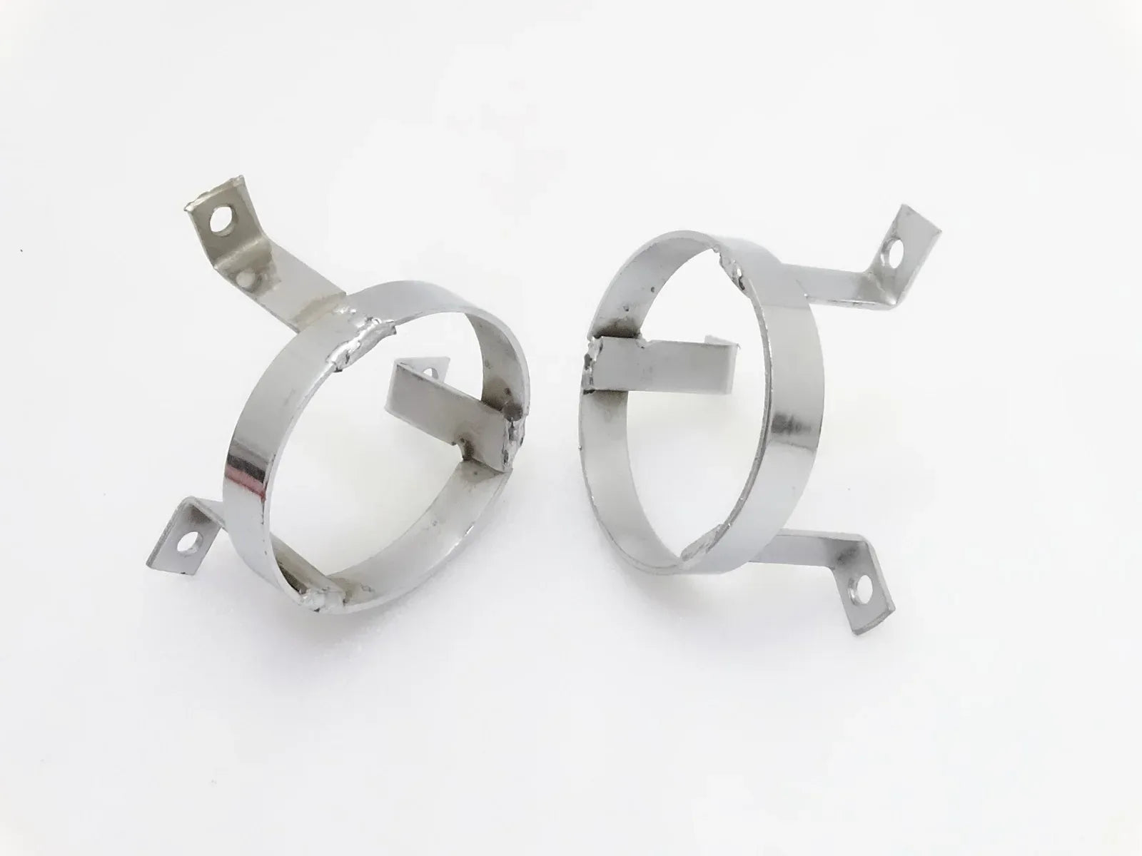 Pair of chrome parking light grill protectors with mounting brackets