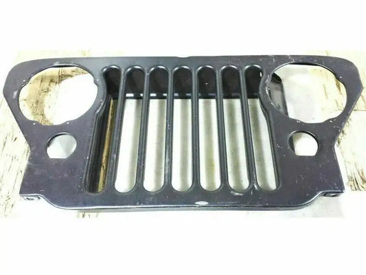 Black front grille panel with two round openings and vertical slots