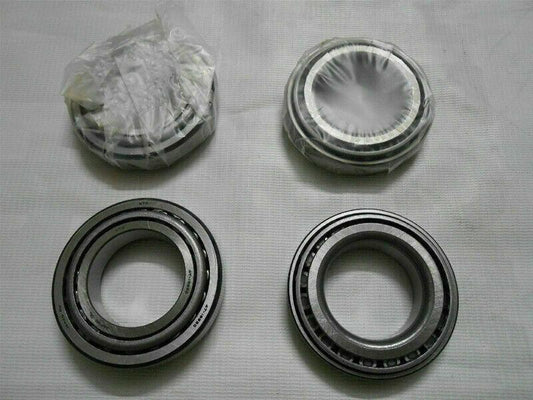 Wheel bearing kit with four metal bearing rings, includes stacked parts in bag