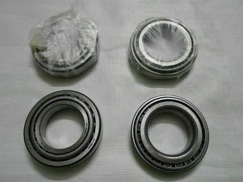 Wheel bearing kit with four metal bearing rings, includes stacked parts in bag