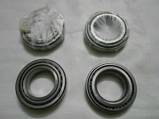 Wheel bearing kit with four metal bearing rings, includes stacked parts in bag