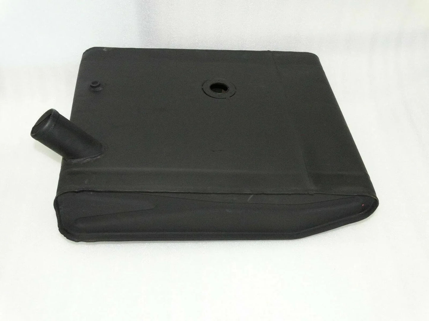 Dark metal fuel tank with cap opening and short filler neck, angled front view