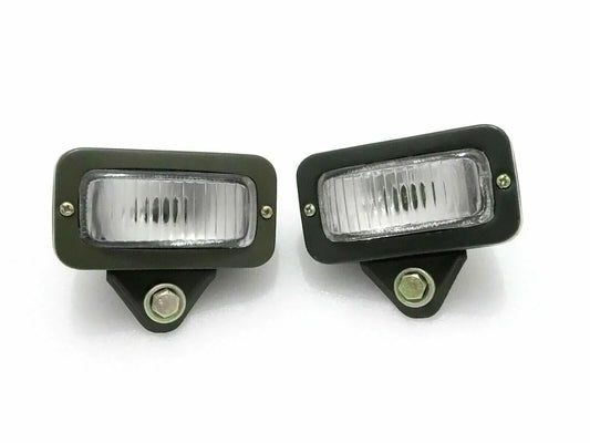 Pair of military parking lights, dark green housings, clear rectangular lenses