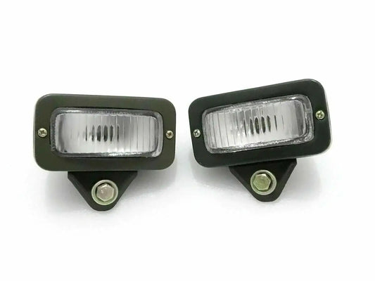 Pair of military parking lights, dark green housings, clear rectangular lenses