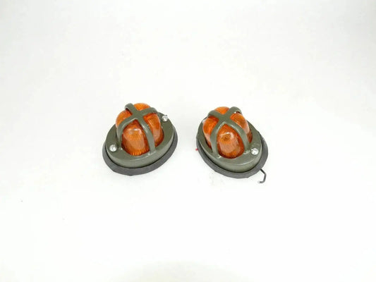 Round orange parking light pair with amber lens and black mounting base