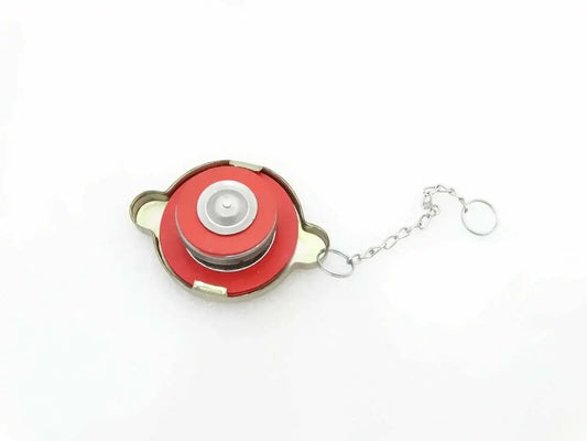 Radiator coolant filler cap with red top, metal base, and chain keyring