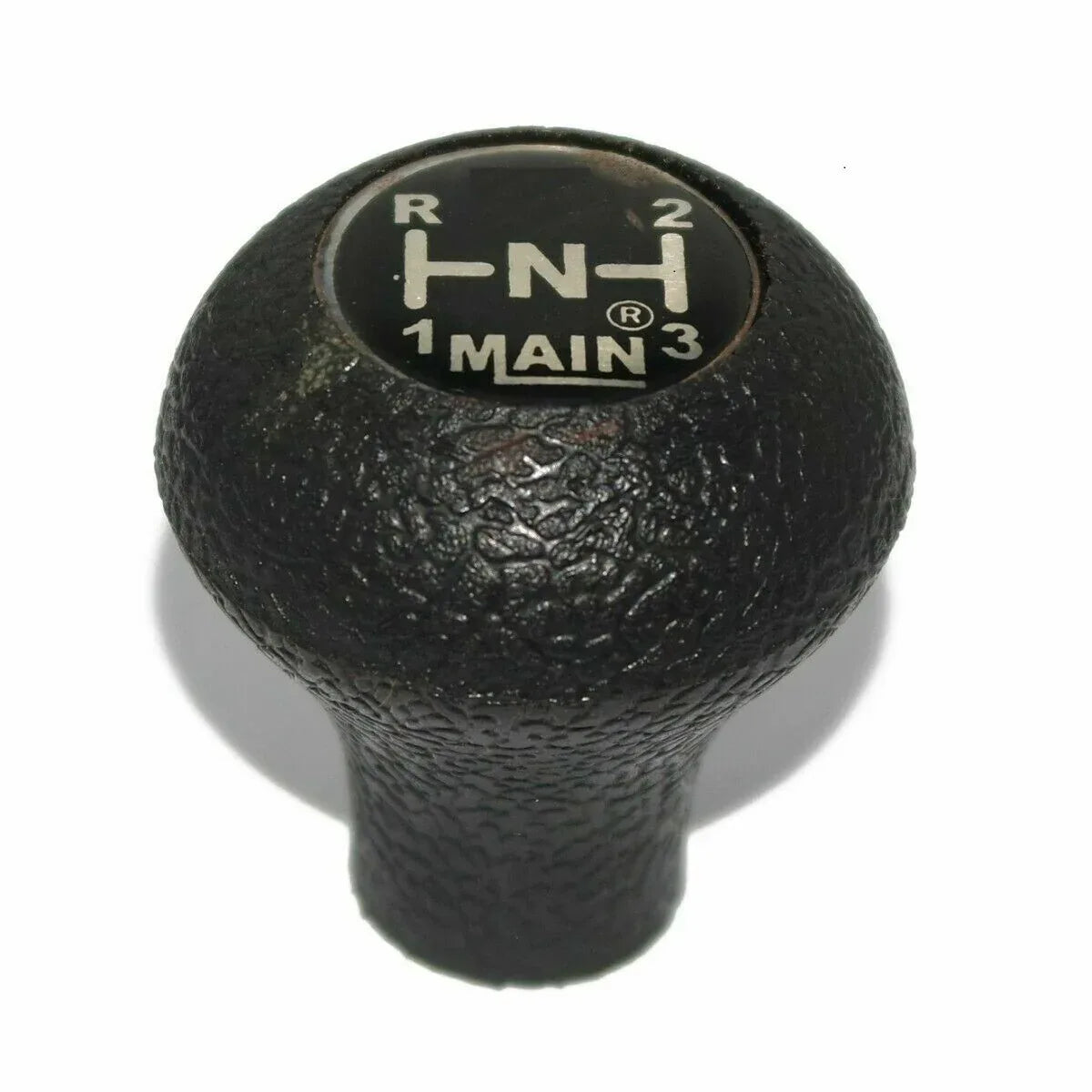 Black textured gear shift knob with gear position markings on top