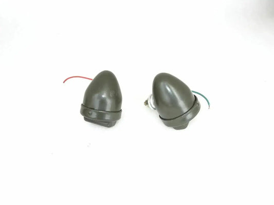 Pair of gray dome cat-eye marker lights with mounting base and wire leads
