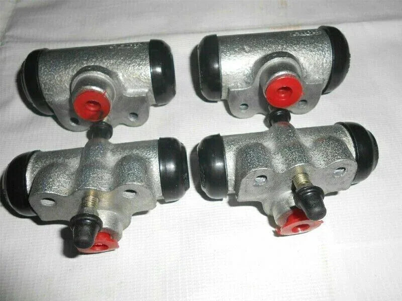 Brake wheel cylinder assembly with four silver cylinders and red dust caps