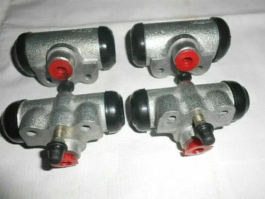 Brake wheel cylinder assembly with four silver cylinders and red dust caps