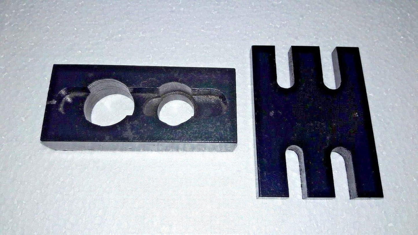 Metal injector adapter plate with two circular holes and forked holder prongs