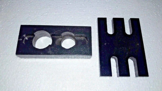 Metal injector adapter plate with two circular holes and forked holder prongs