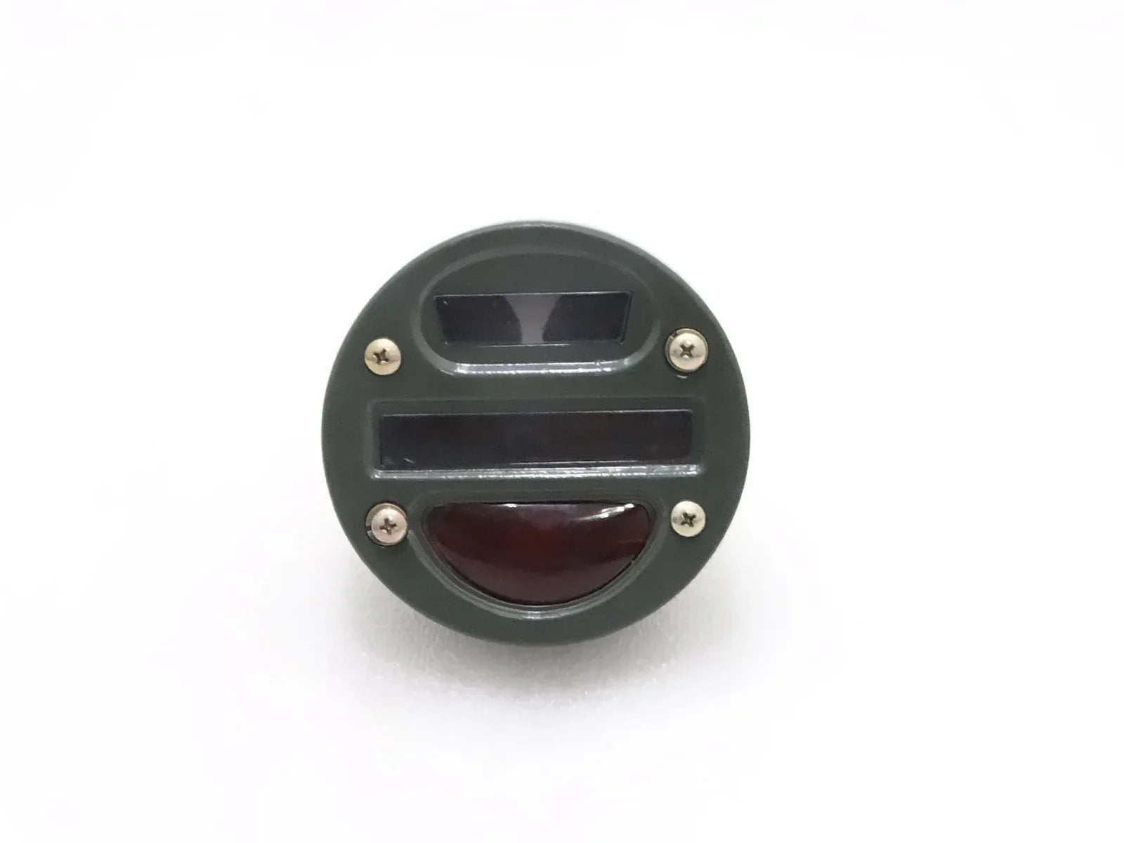 Round tail light cat-eye with clear top lens and red lower lens, black housing.