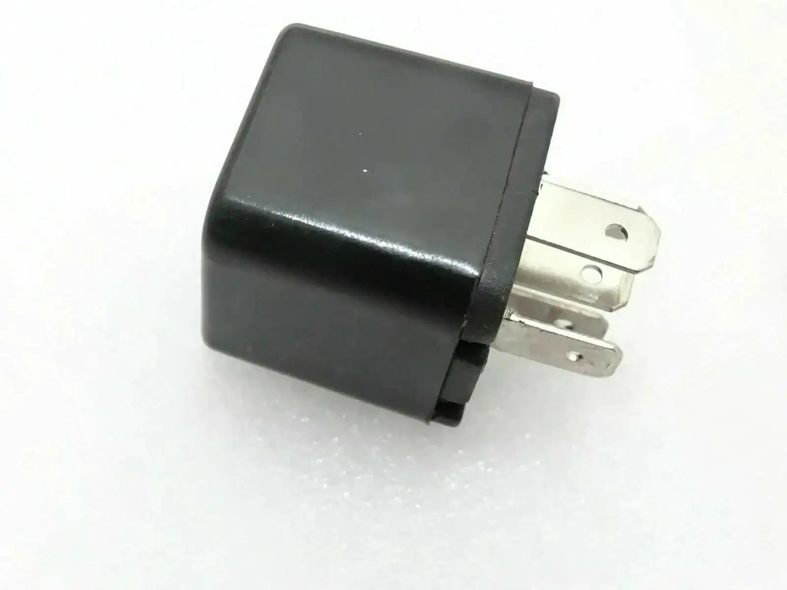 Mini relay switch with black housing and three metal electrical terminals