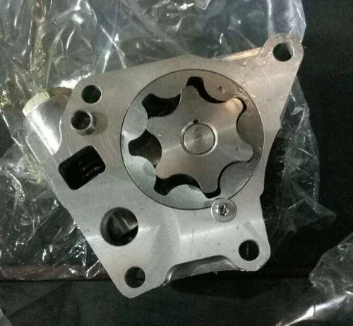 Metal oil pump plate with circular gear cutout and mounting holes, in silver