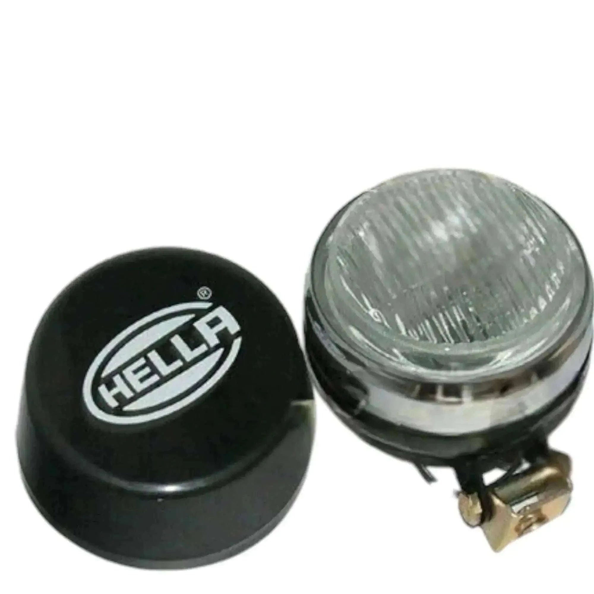 Hella fog lamp with clear lens and black cover, bulb holder visible