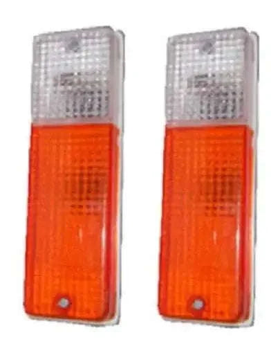 Parking light assembly with clear top lens and orange bottom lens, rectangular housing