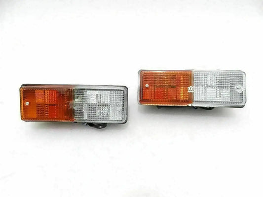 Tapered parking light assembly pair with amber and clear rectangular lenses