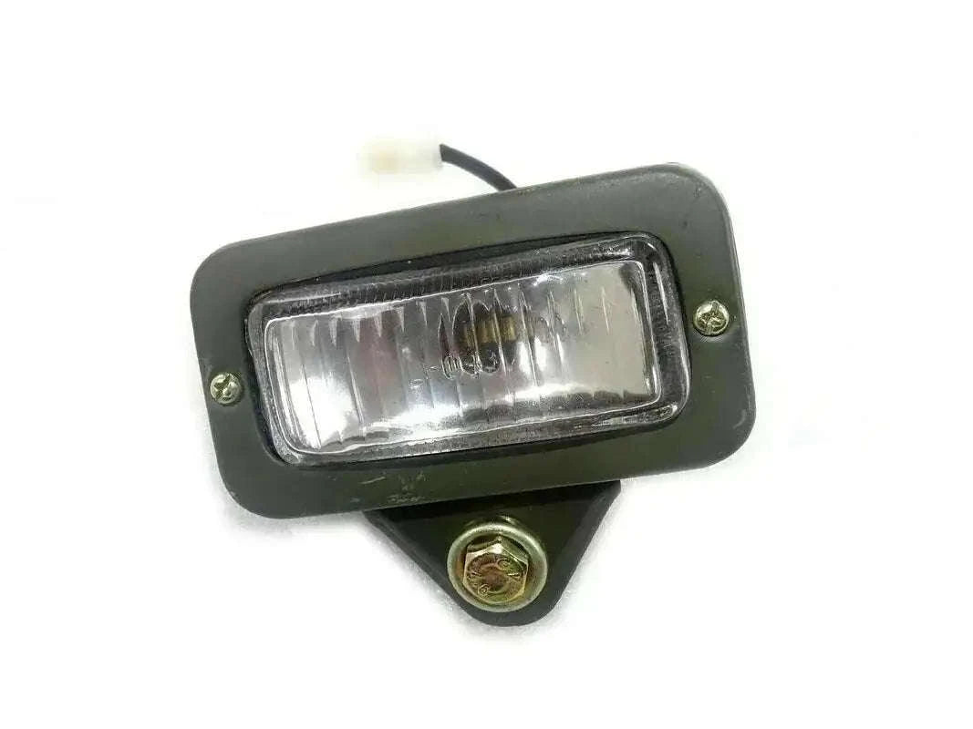 Rectangular parking light with clear lens, black housing, and metal mounting bracket.
