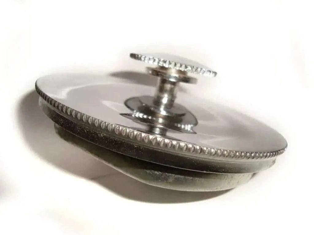 Metal fuel tank cap with knurled edge and central bolt