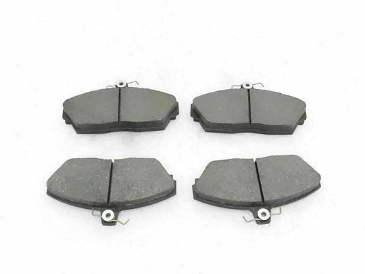 Disc brake pad set with four dark gray brake pads