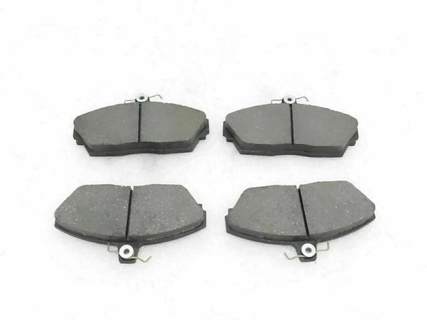 Disc brake pad set with four dark gray brake pads