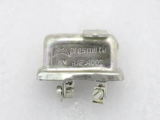 6-volt horn relay with metal housing and two electrical terminals