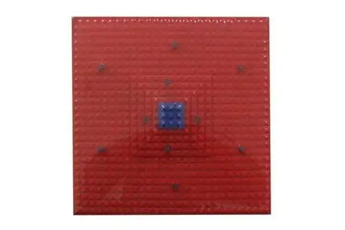 Red magnetic reflexology foot mat with blue square center magnet and raised dot studs