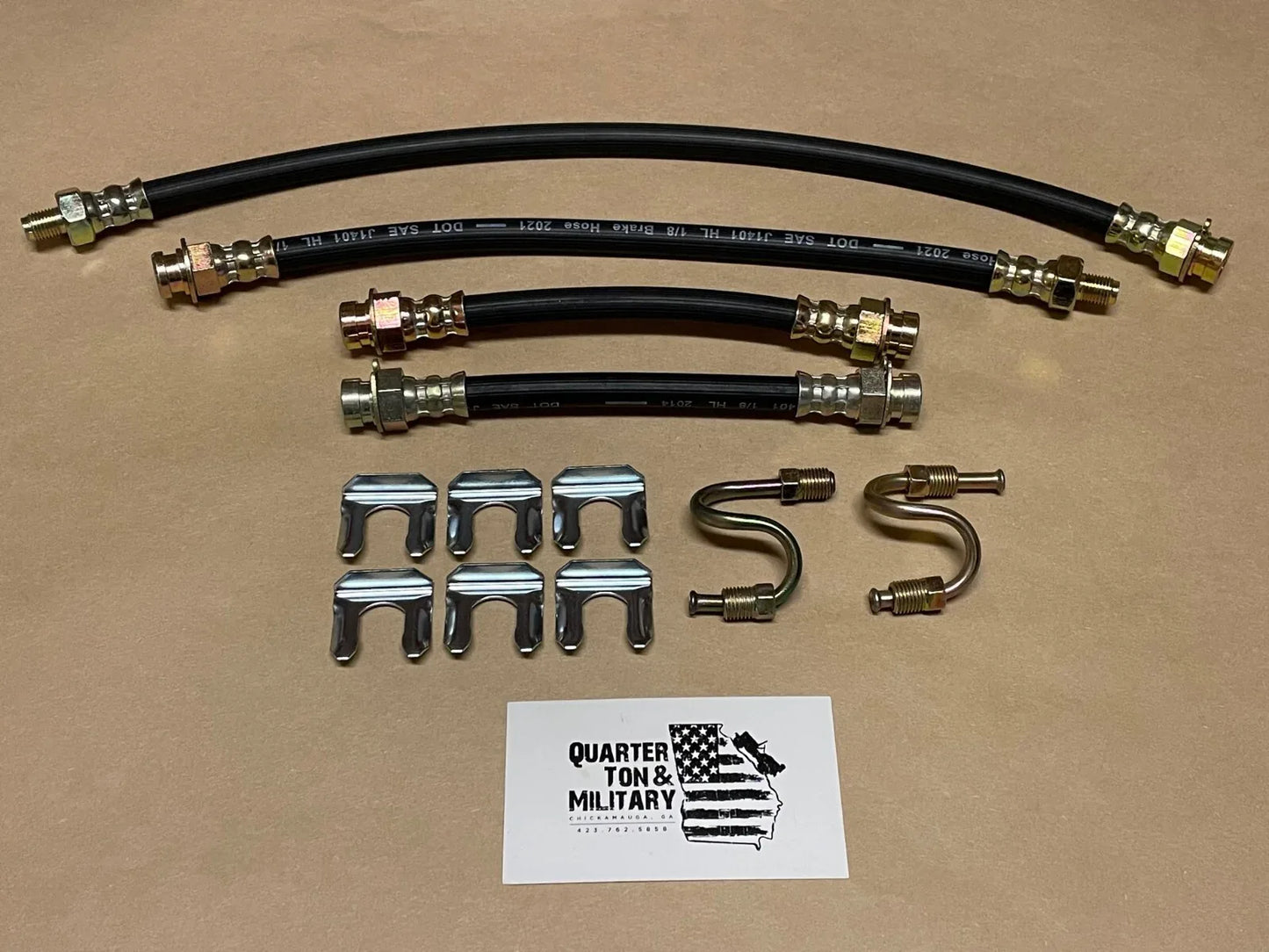 Brake hose kit with black rubber hoses and metal fittings, plus clips and brackets