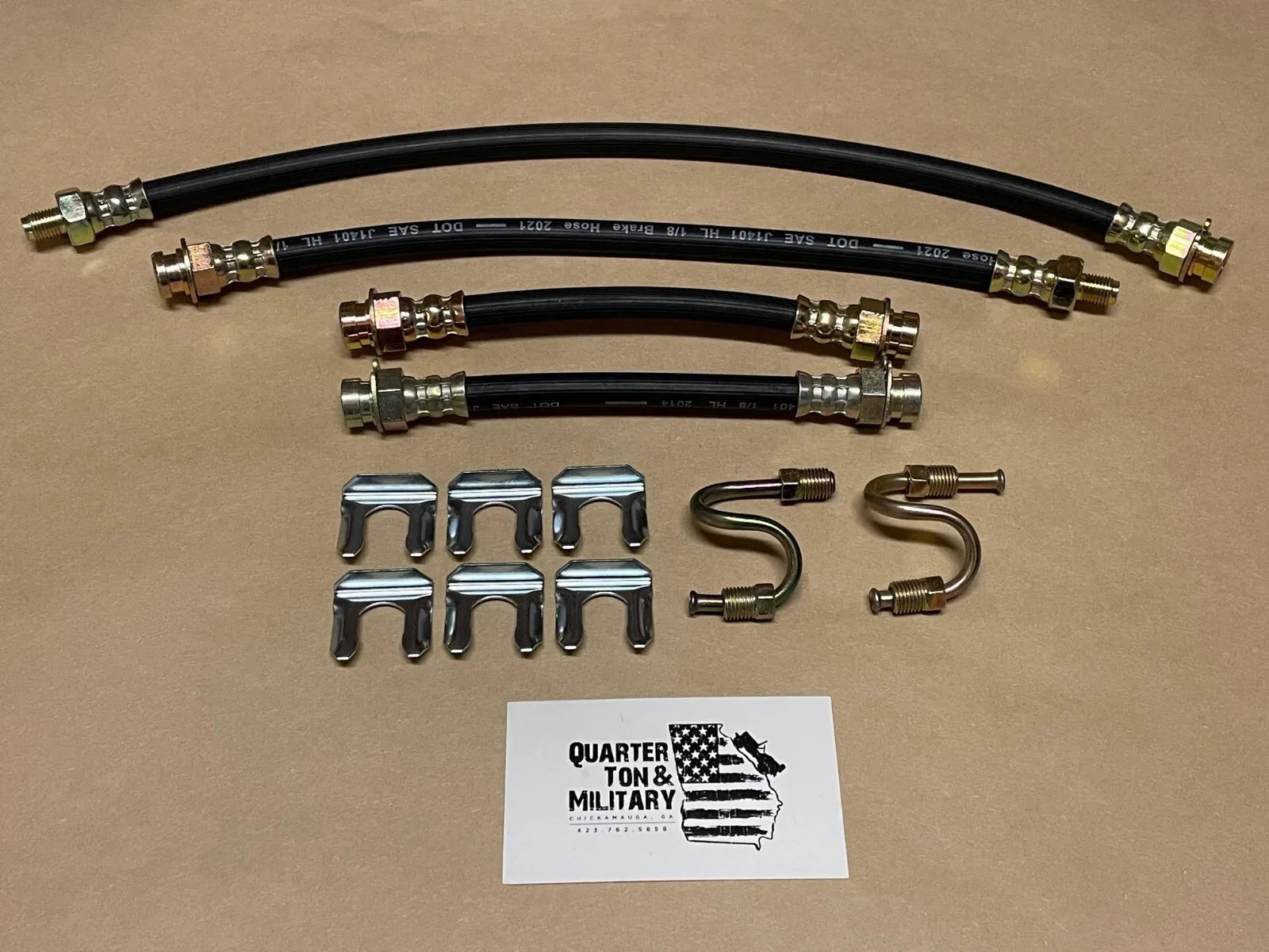 Brake hose kit with black rubber hoses and metal fittings, plus clips and brackets