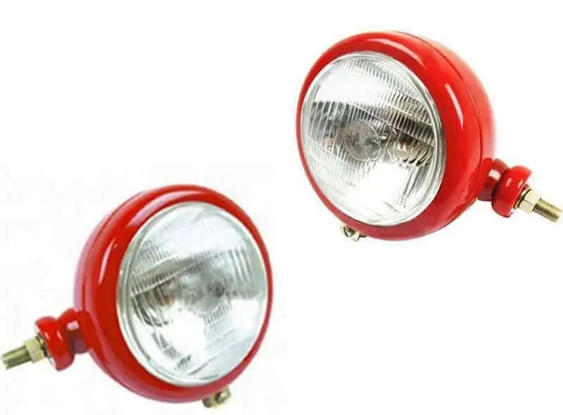 Pair of red tractor headlights with clear lenses