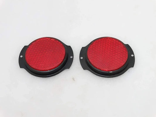 Pair of red reflectors with black bezels, durable for vehicle safety and visibility, ideal for installation.