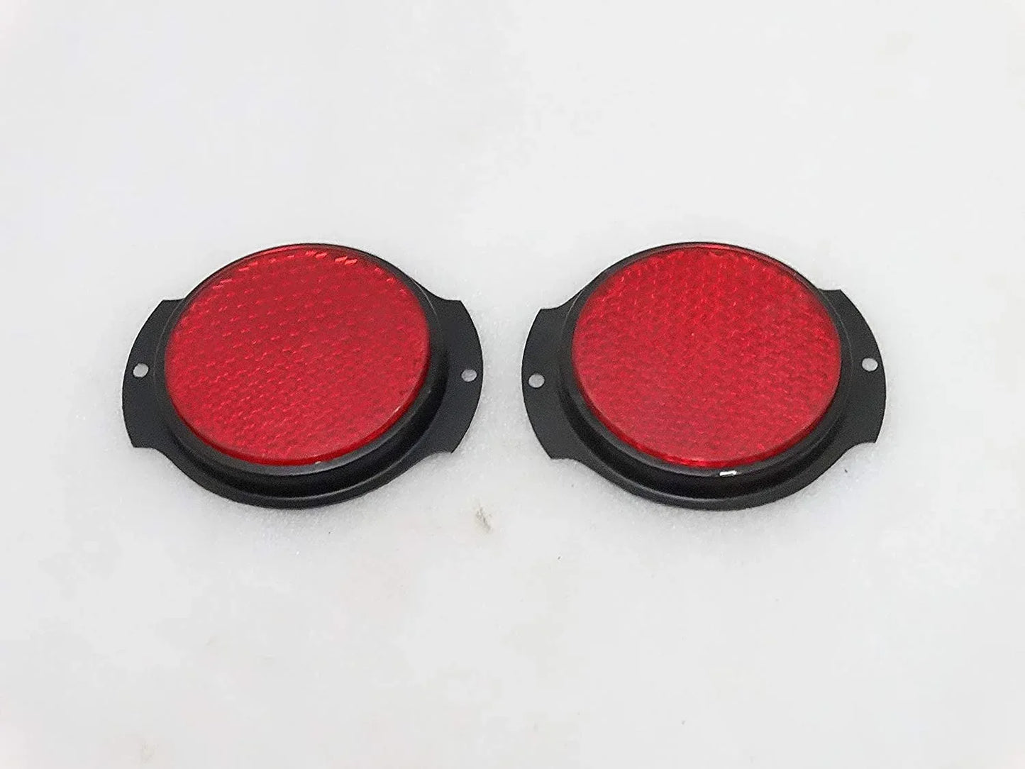 Pair of red reflector lights with black bezels, durable for vehicle safety use.